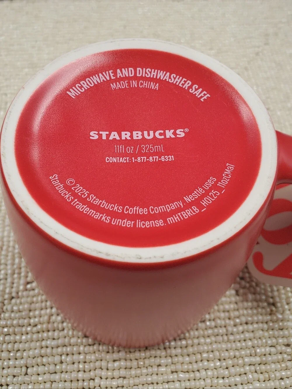 Starbucks mate finished coffee mug featuring a minimalist solid red exterior